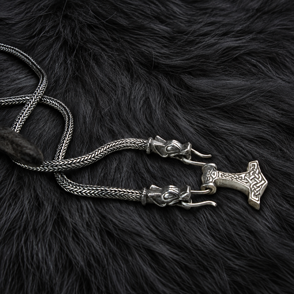Valhallas Silver Thor's hammer necklace with Viking-knit chain in sterling silver on dark fur